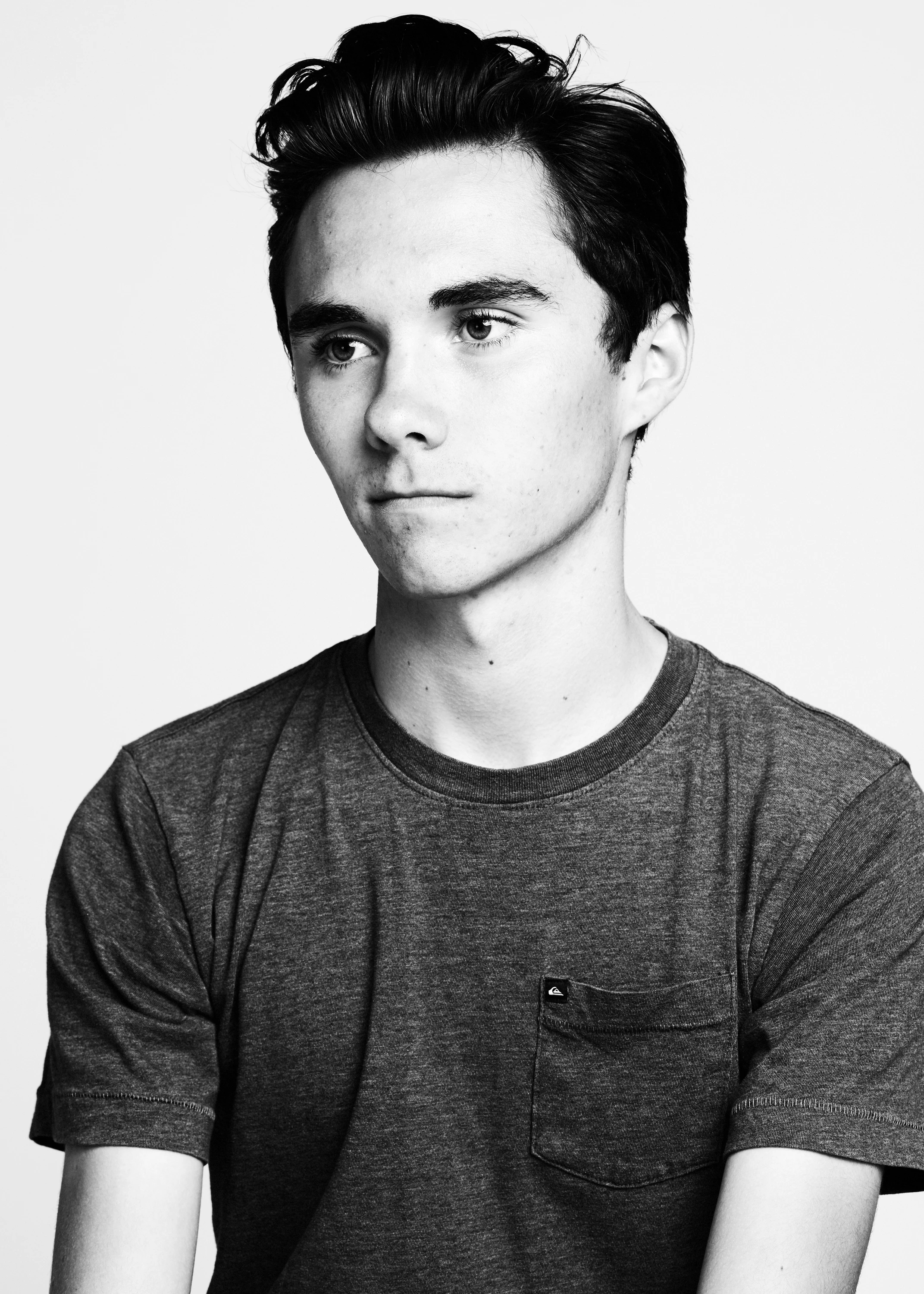 Black-and-white portrait of a participant wearing a gray T-shirt.