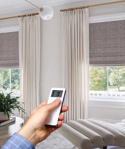 Motorized Roman Shade with Pinch Pleat Drapery