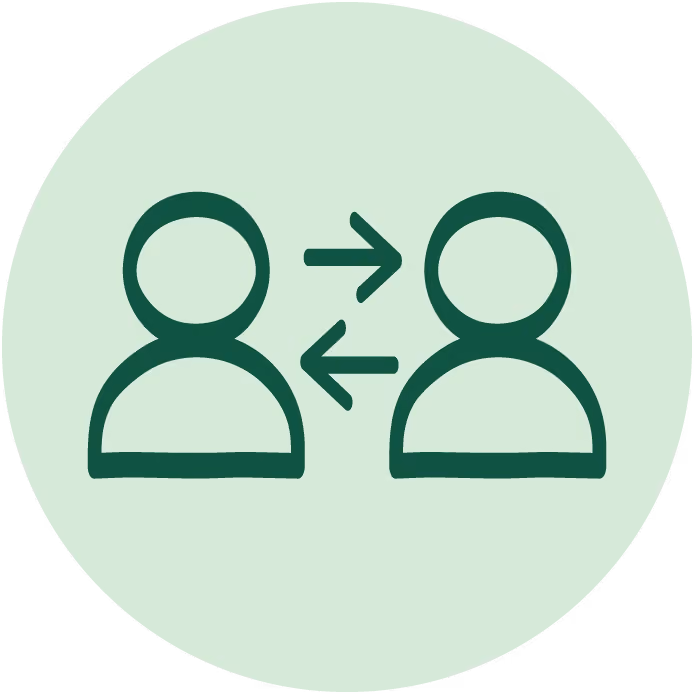Two user icons facing each other with arrows pointing both ways between them on a light green circle.