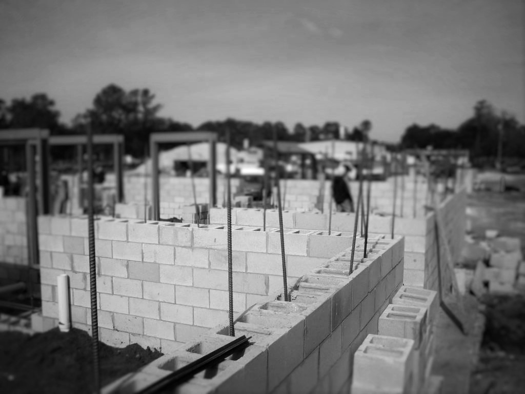 Metal framing and overhead MEP rough-in on an Arete jobsite