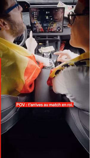 blue2purple - Two supporters wearing Belgian flags sitting in a car with a French caption