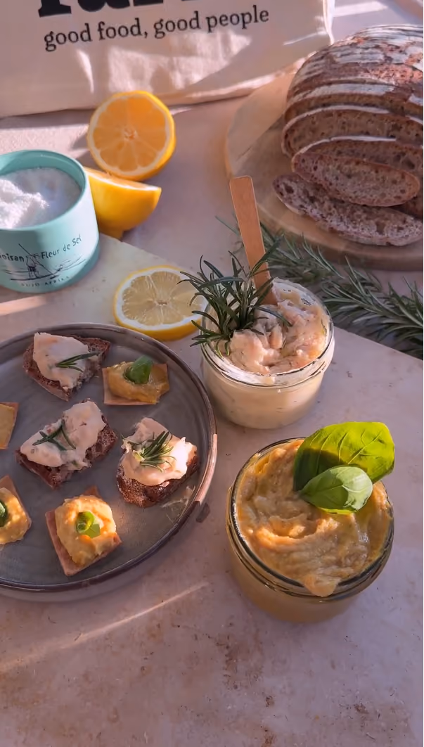blue2purple - Rye canapes with cream topping and a jar of orange dip beside sourdough bread