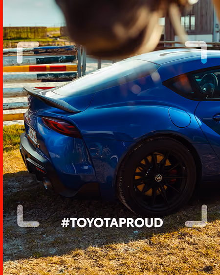 blue2purple - A blue Toyota Supra parked on grass beside a track with the hashtag TOYOTAPROUD