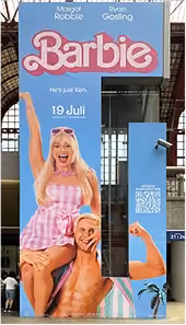 blue2purple - Barbie film poster on a pillar in Antwerp station