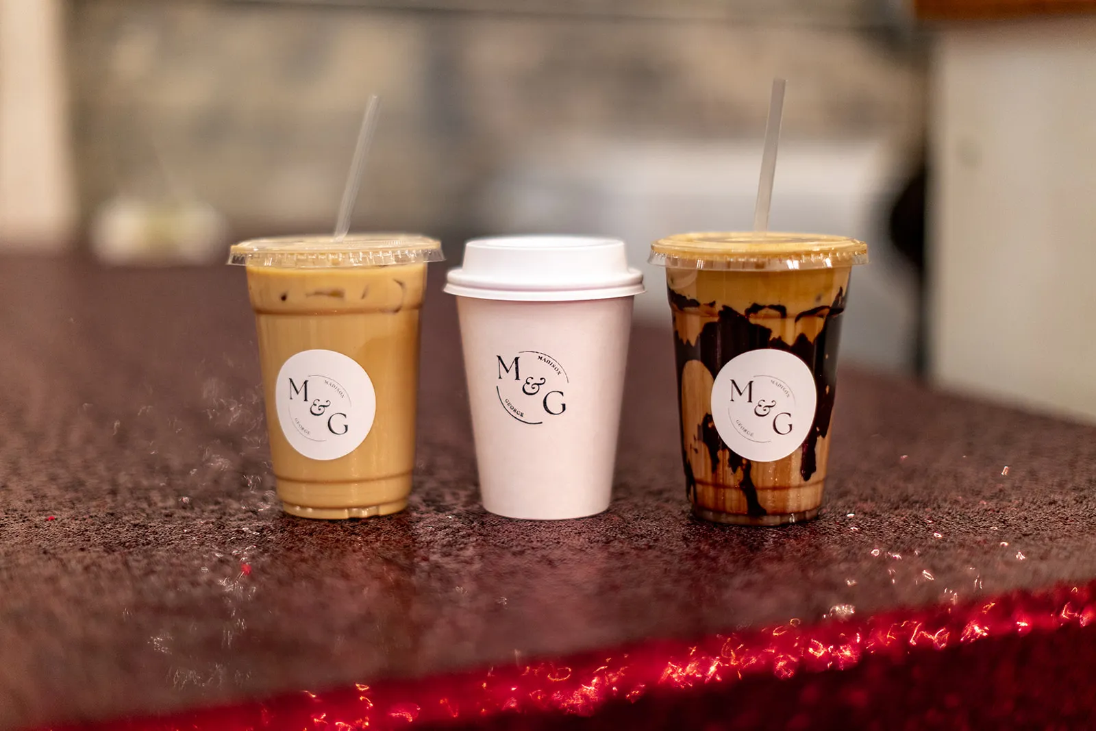 Madison and George branded coffee cups