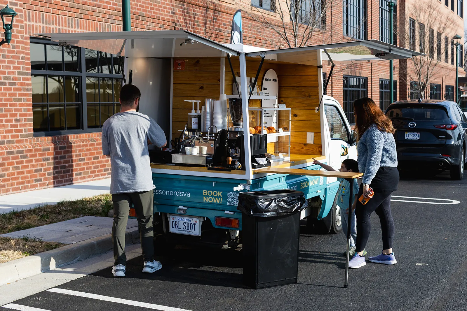 Mobile espresso truck serving coffee outdoors