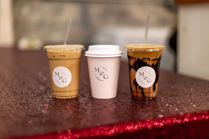Madison and George branded Espresso Nerds coffee cups