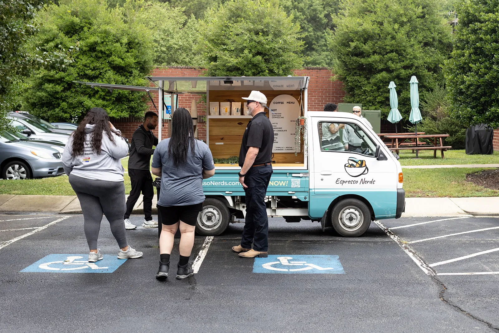 Guests lining up at the Espresso Nerds coffee truck in a parking lot