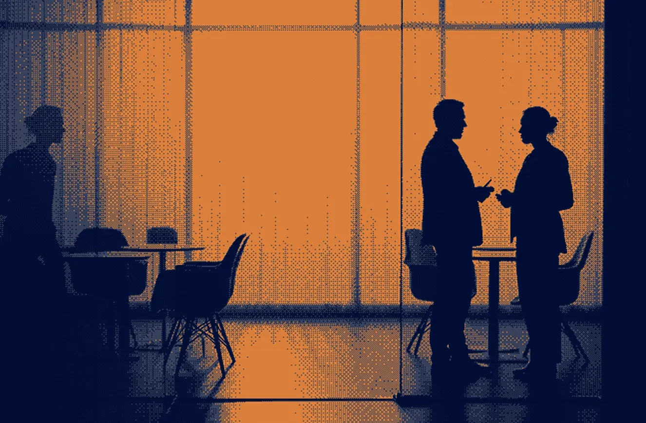 Silhouettes of three people in a modern office setting with tables and chairs; two are standing and conversing near a table while one person is walking on the left side, all shown against a large orange-lit window background.