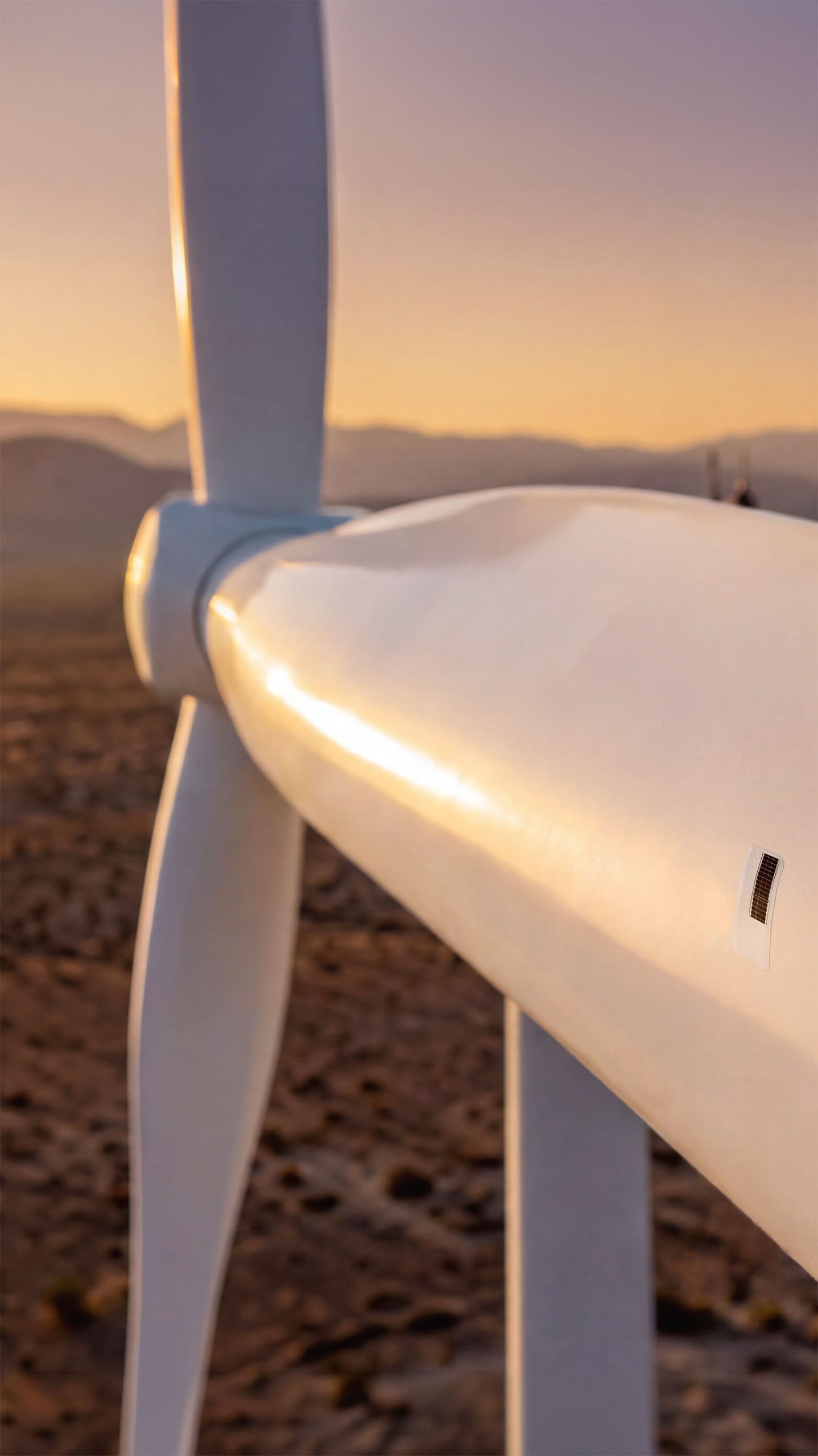 Wind turbine blade at desert sunset with an Aerosense sensor patch