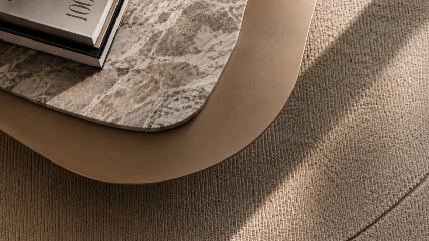 Sunlight falling across a marble surface and woven textile