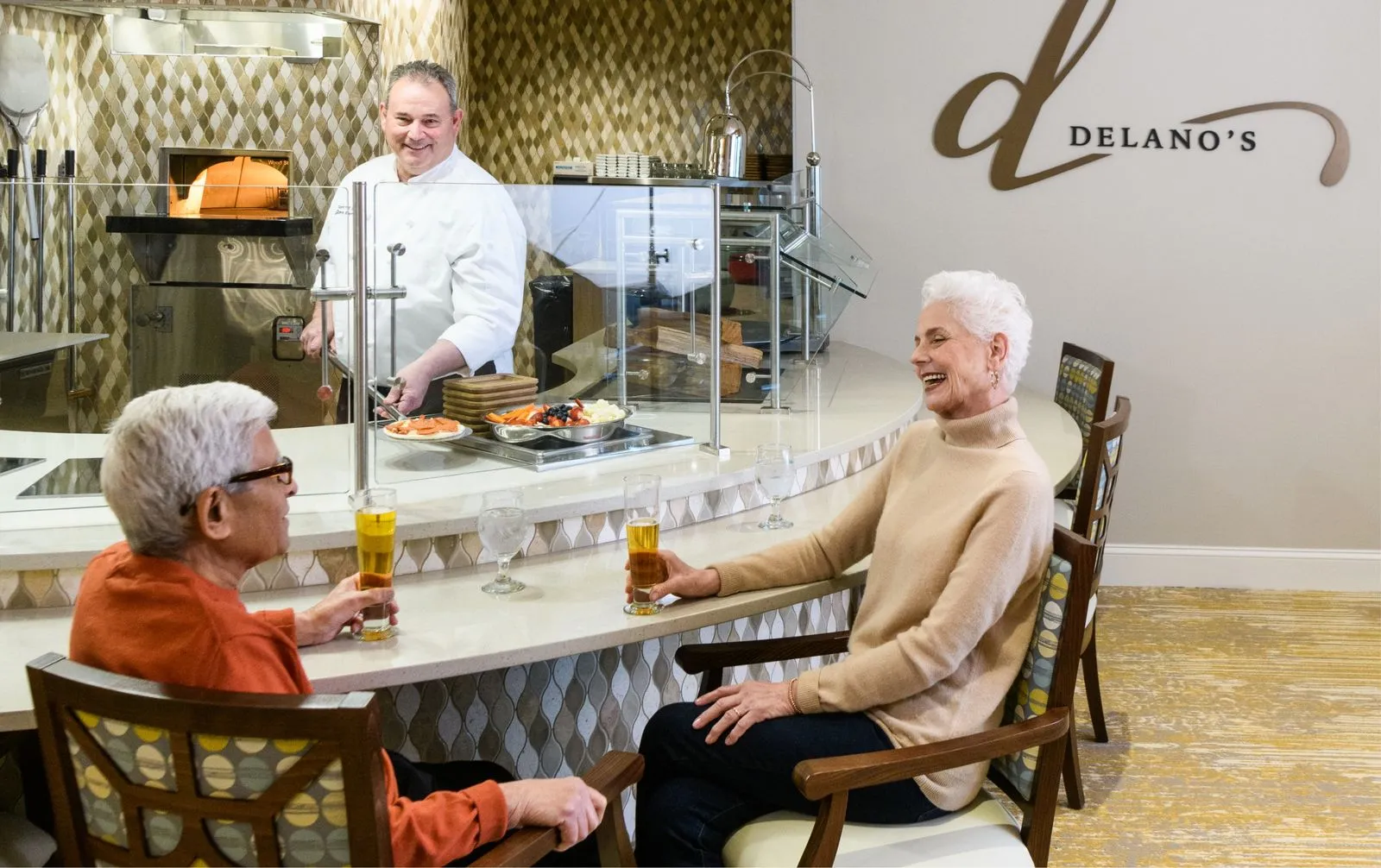residents eating at the bar in the delanos dining area