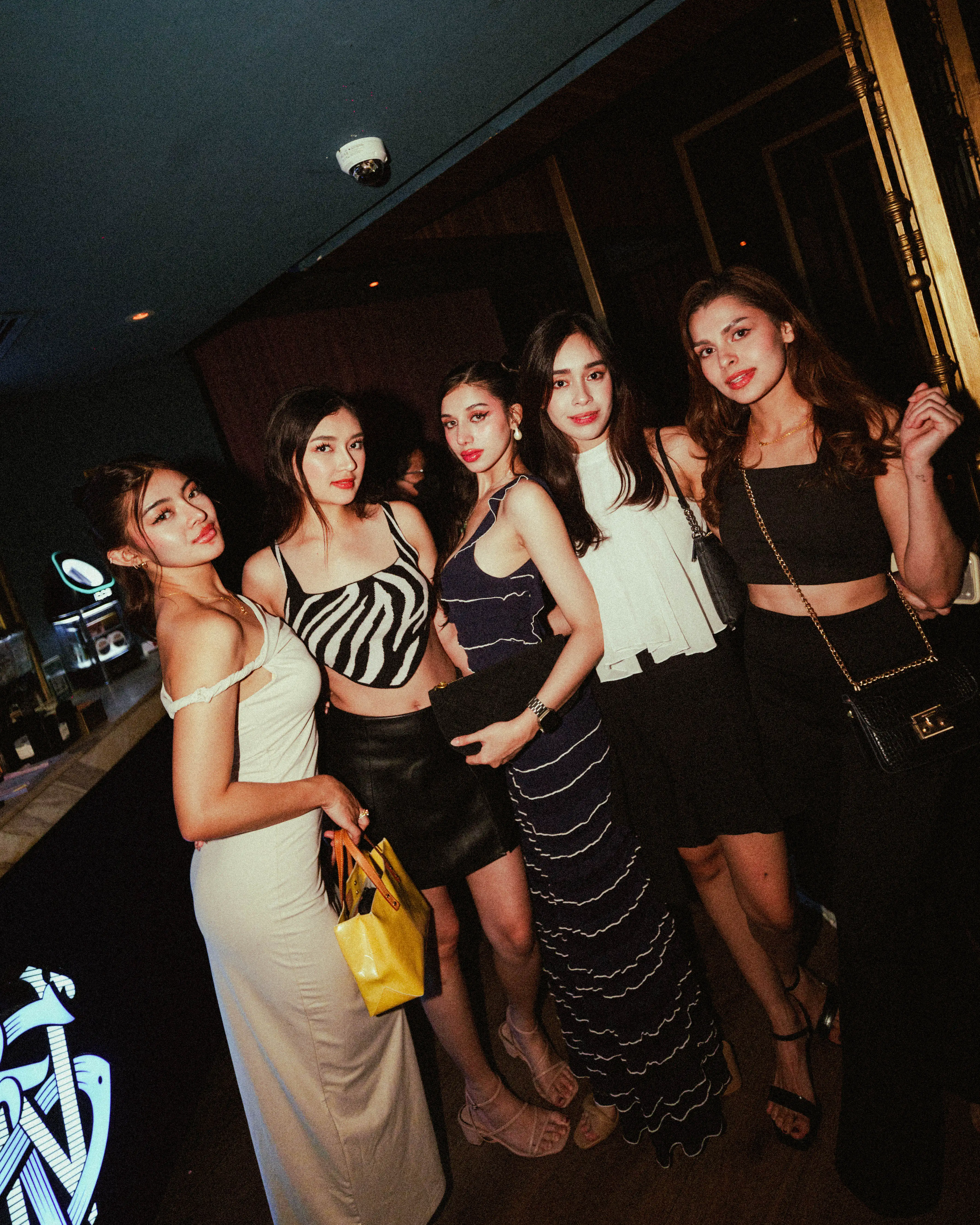 Guests posing together at Revel luxury lounge, The Palace Manila BGC