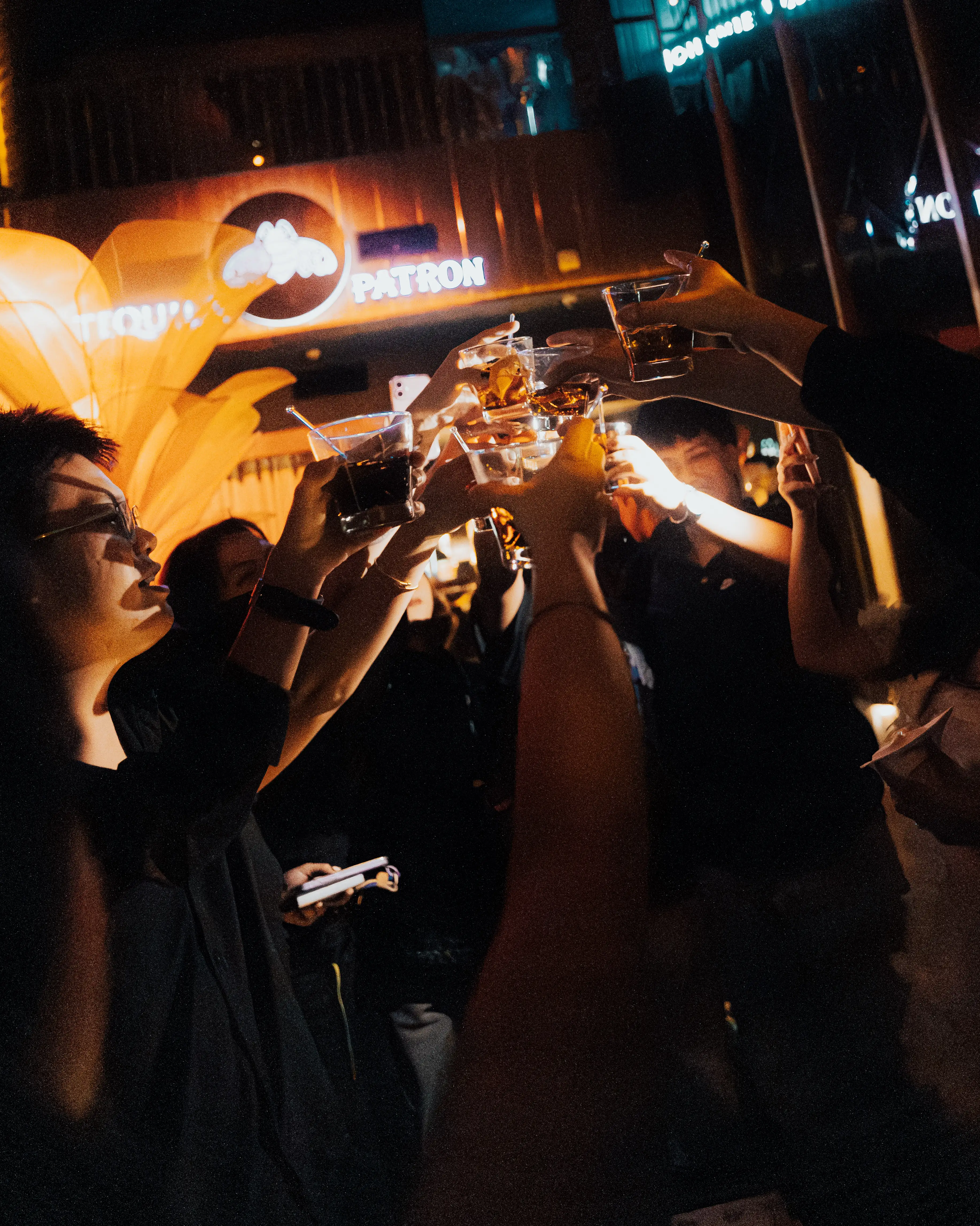 Guests toasting with bottle service at Revel, The Palace Manila
