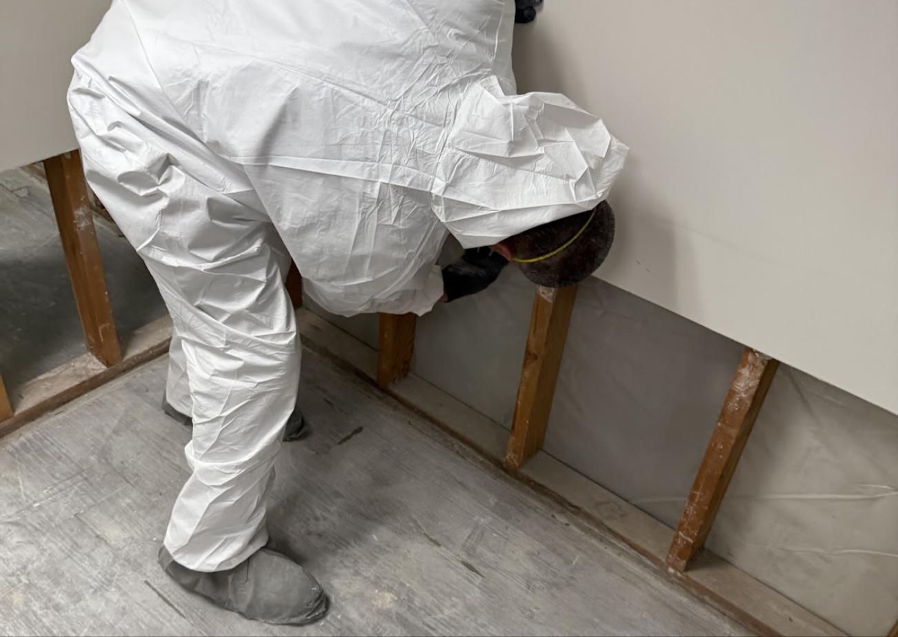 Technician documenting water-damaged belongings for an insurance claim in Hampden County, MA