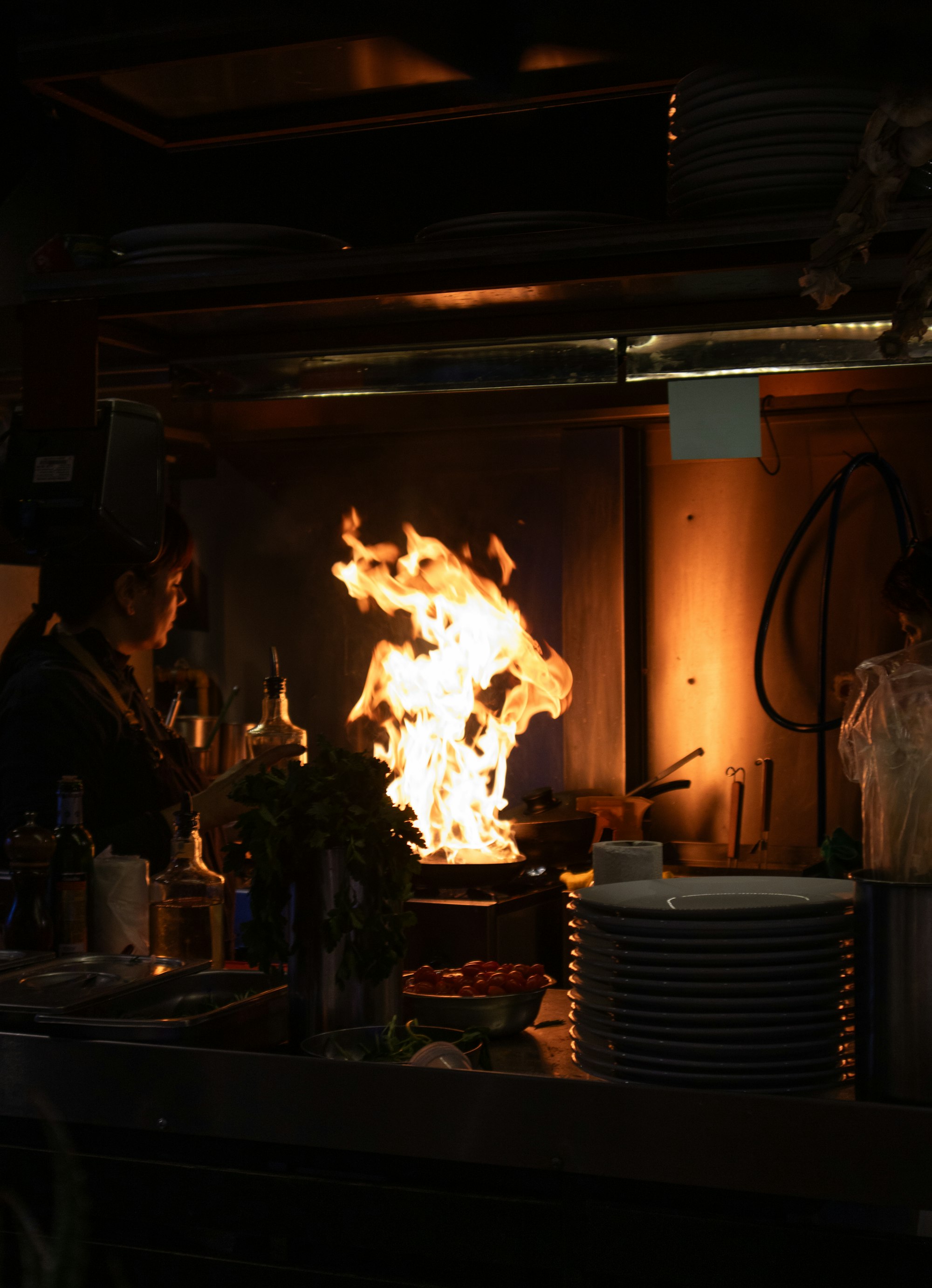 Active kitchen fire with flames near the stove before fire and smoke damage restoration in Hampden County, MA