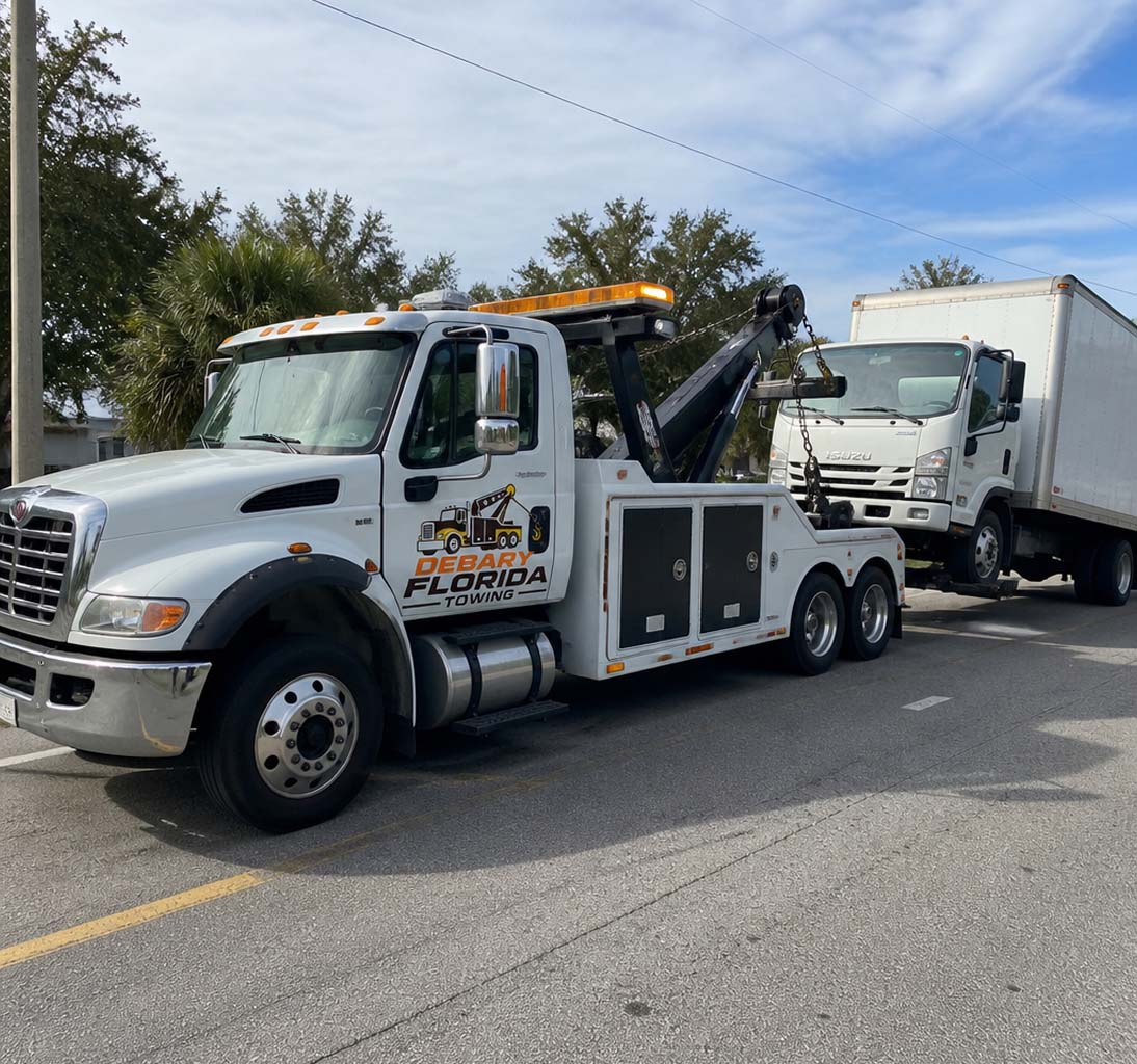 Heavy-duty wrecker recovering a semi
