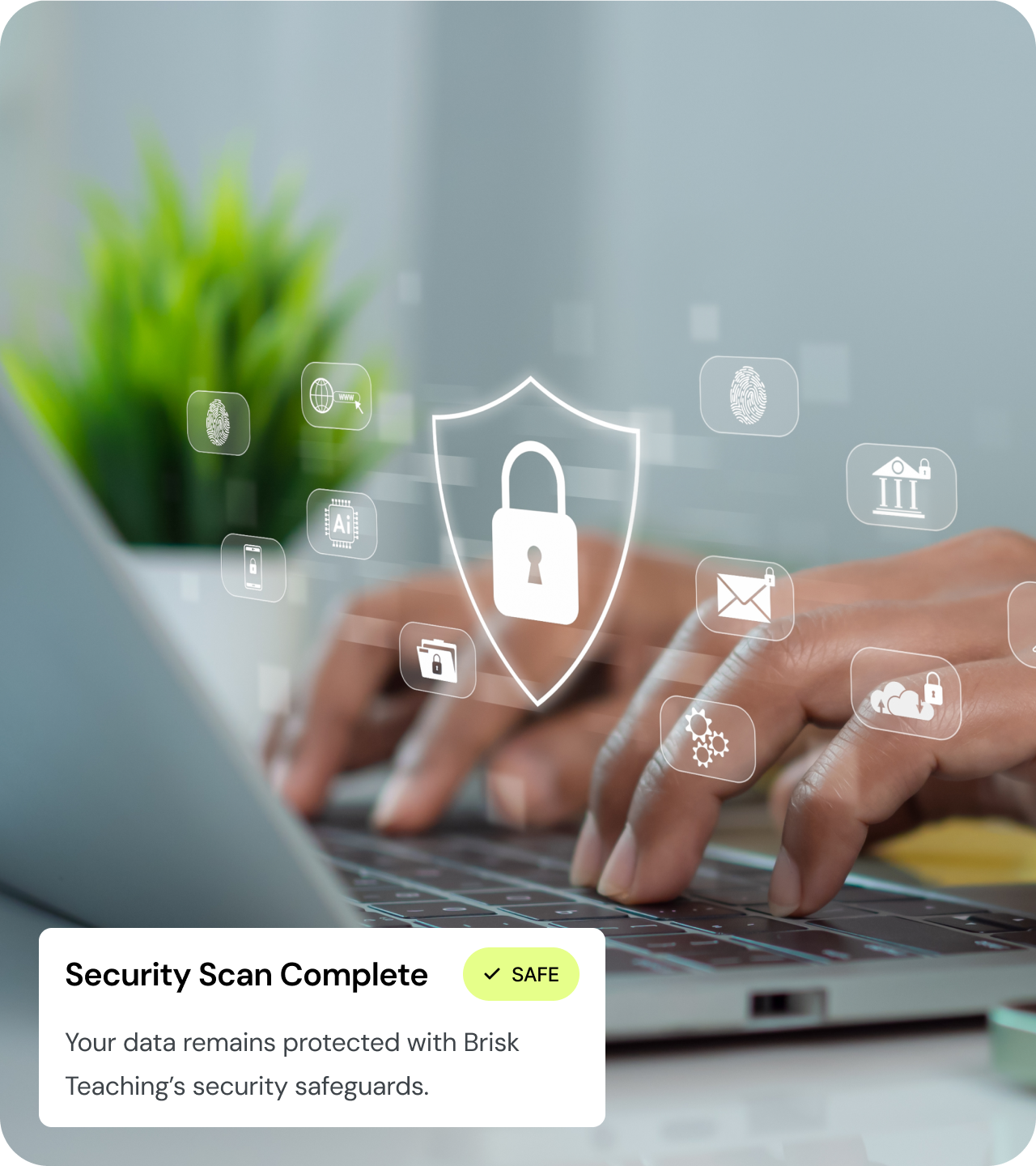 Hands typing on a laptop with a security shield overlay