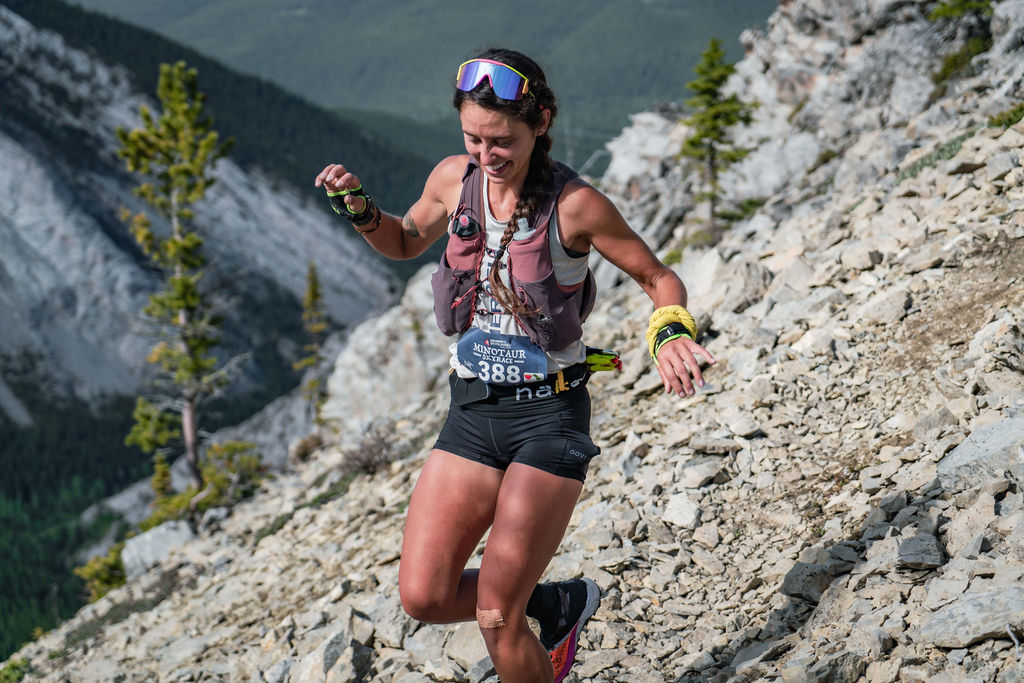 Runner navigating rocky mountain terrain during the Minotaur Skyrace in Crowsnest Pass, Alberta