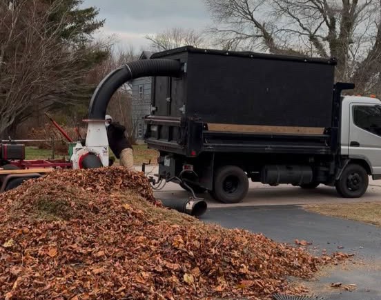 Deep green lawn striping patterns on a large residential estate in coastal Rhode Island.