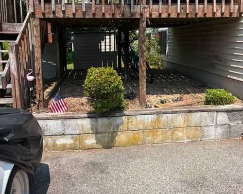 Deep green lawn striping patterns on a large residential estate in coastal Rhode Island.