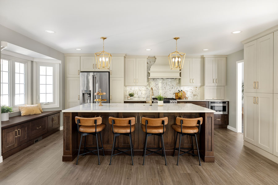 Kitchen with large island, pendant lights, and blue cabinetry