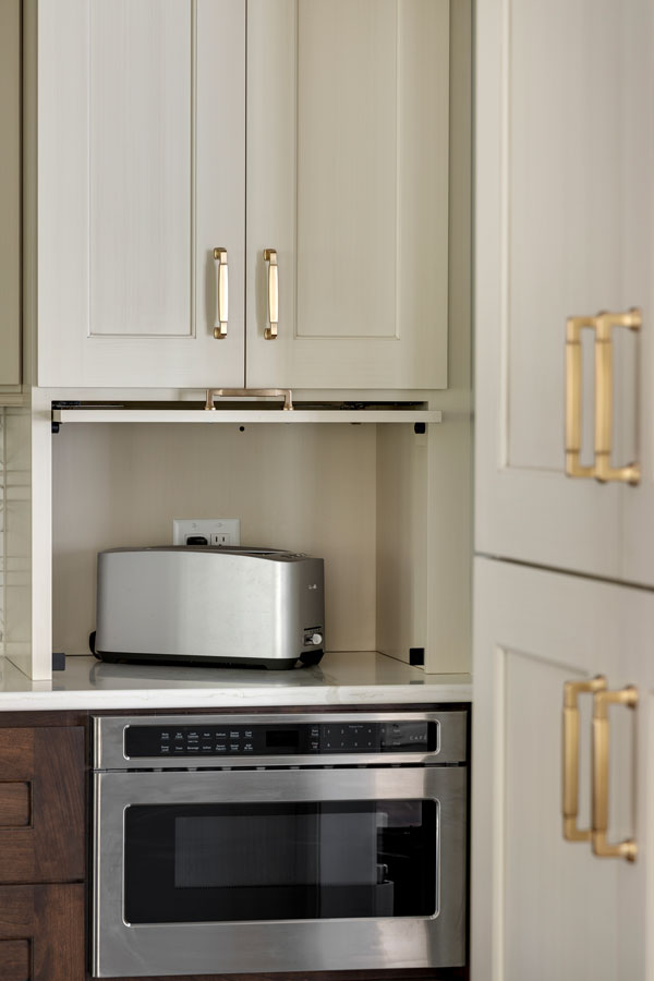 Drawer microwave with pocket door appliance garage above
