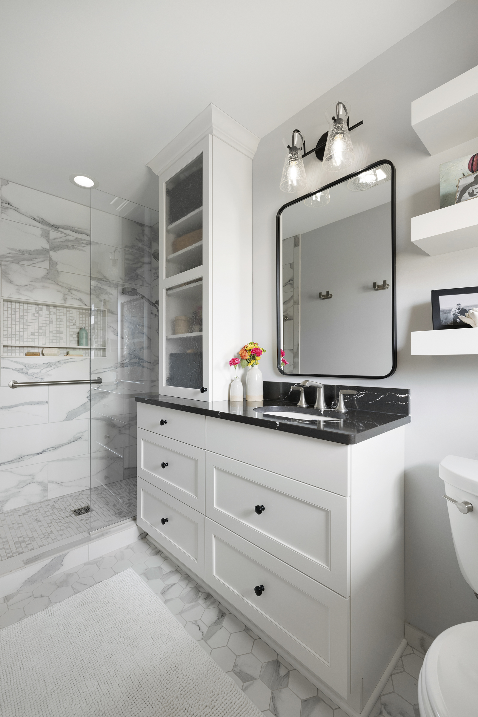 Bright accessible bathroom with curbless shower