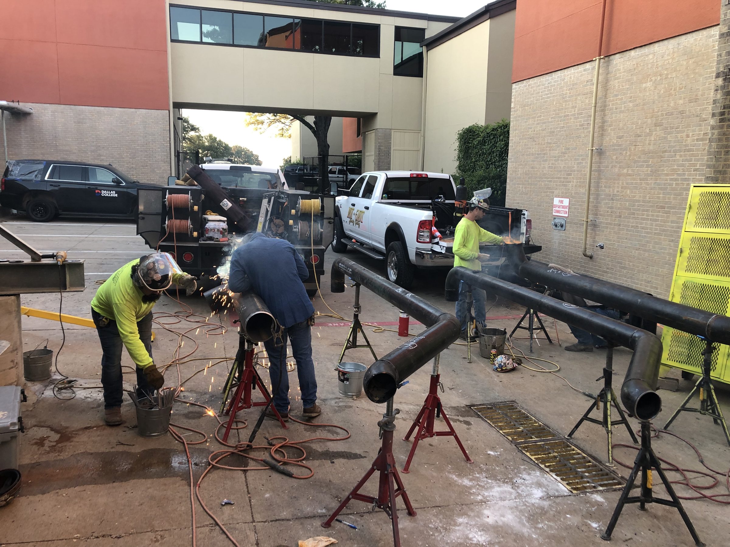 Hot Shot pipefitters staging welded pipe spools in the yard