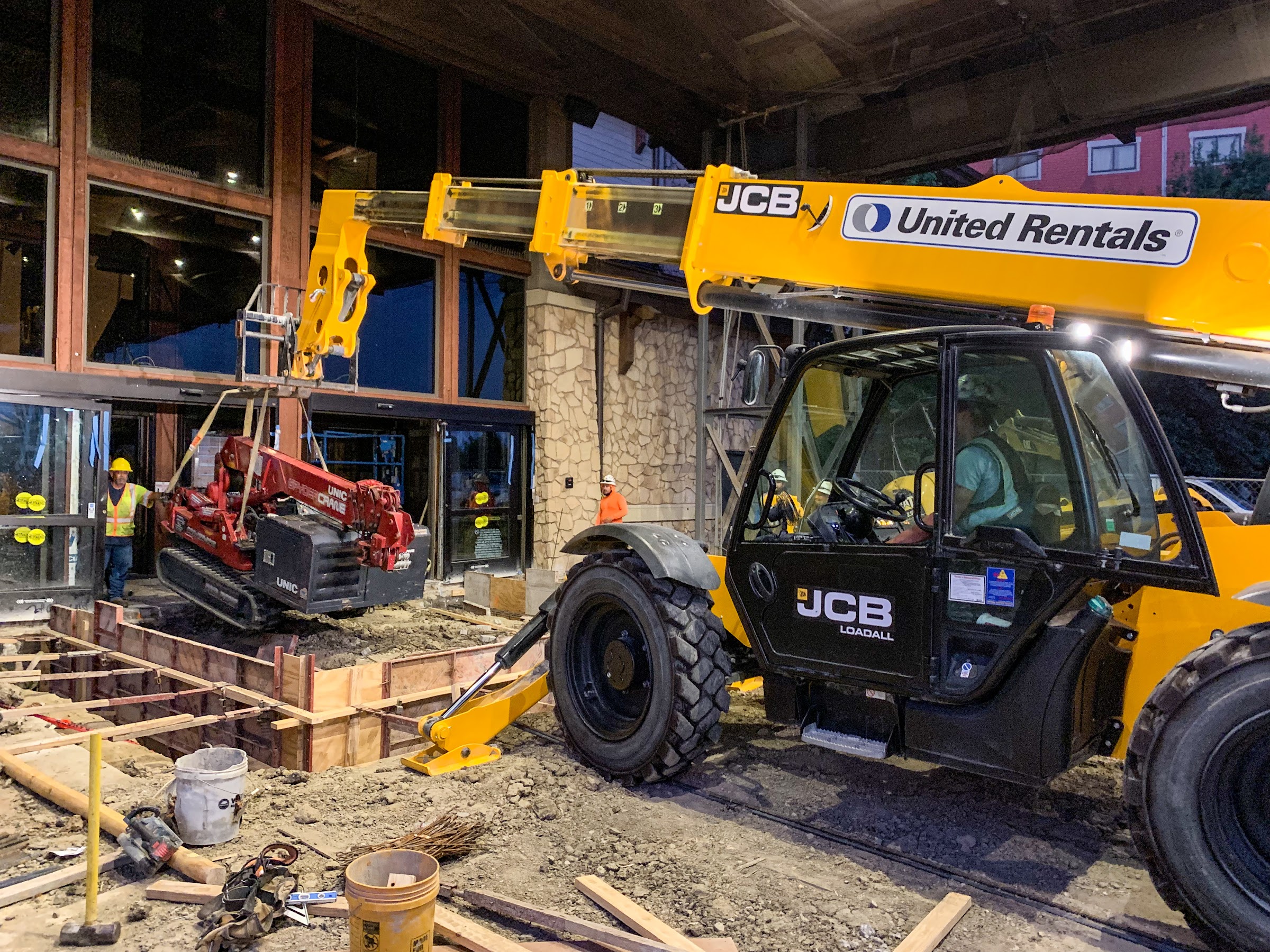 Telehandler moving steel inside the building