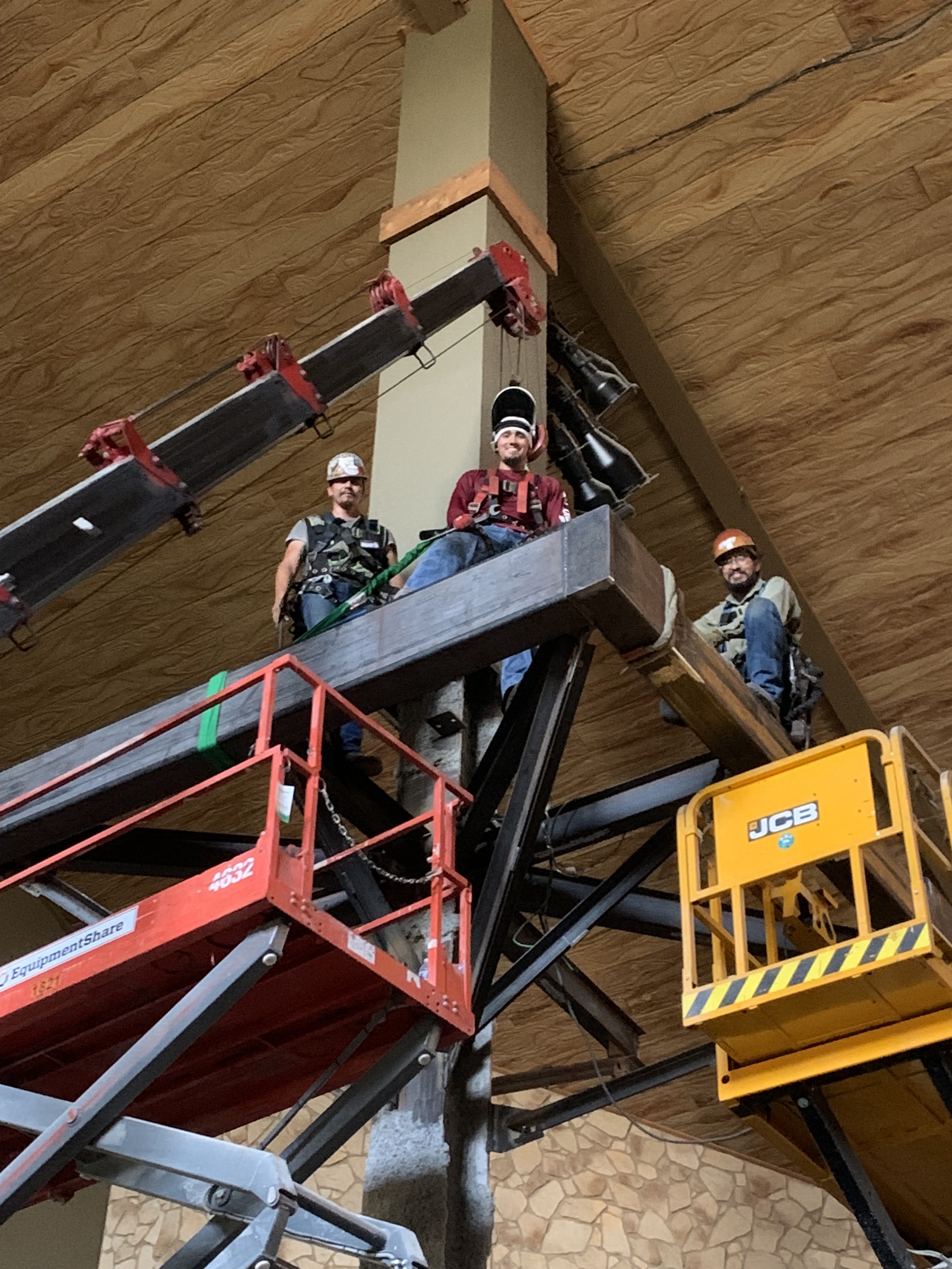Crew erecting the treehouse from lifts