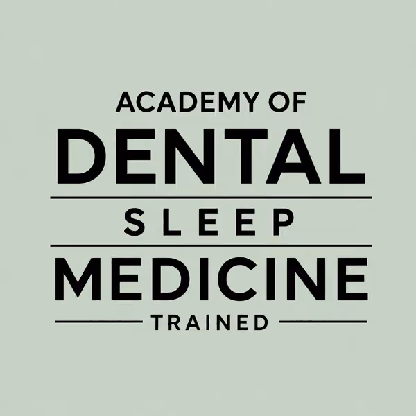 Text logo stating Academy of Dental Sleep Medicine Trained in black font on a pale green background.