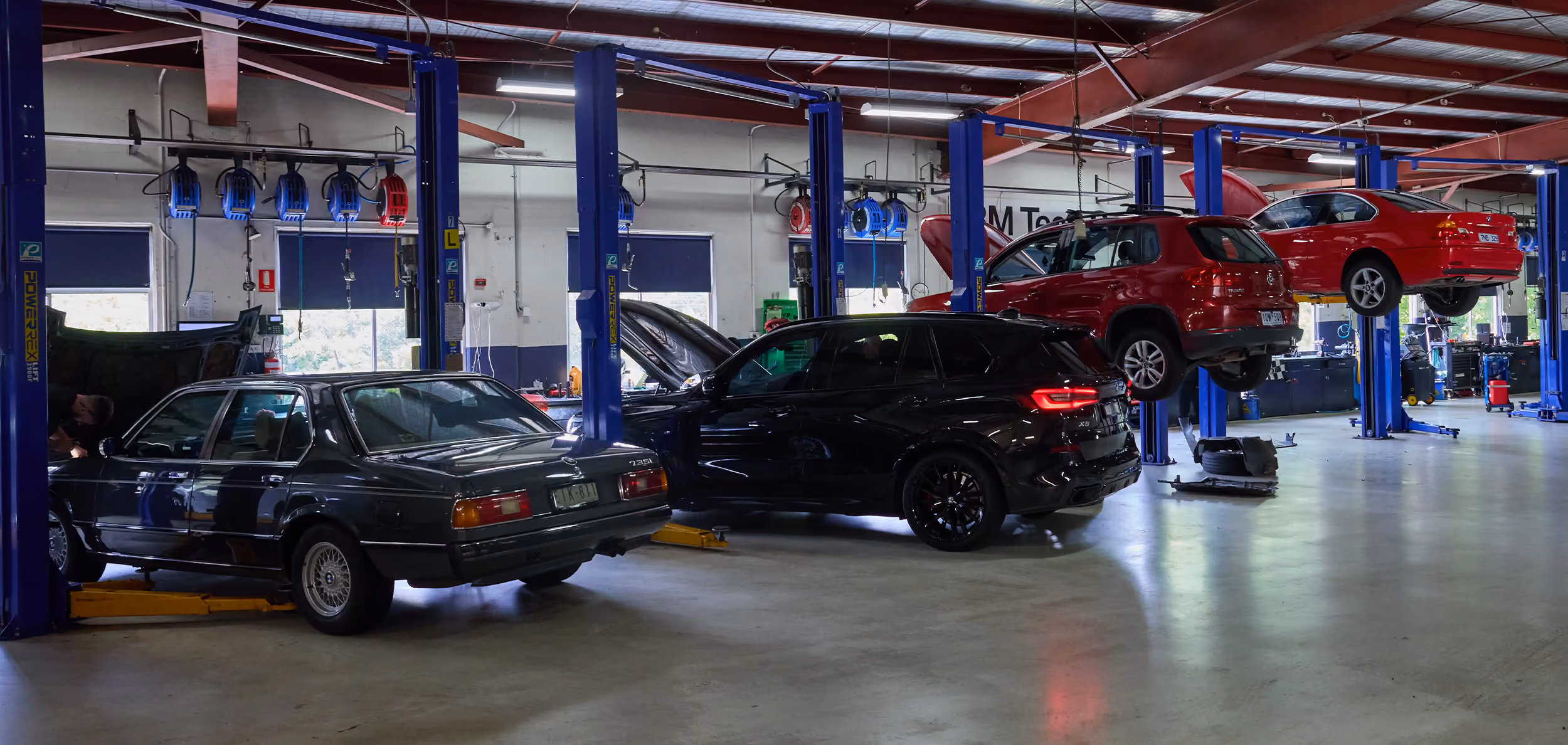 BM Tech servicing centre with a white vehicle getting work done.