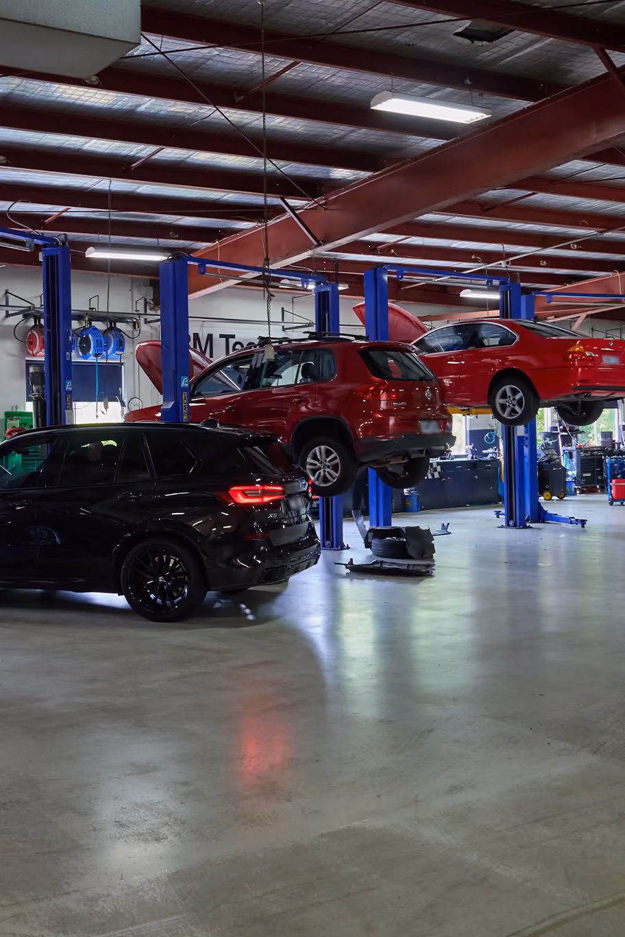 BM Tech servicing centre with a white vehicle getting work done.