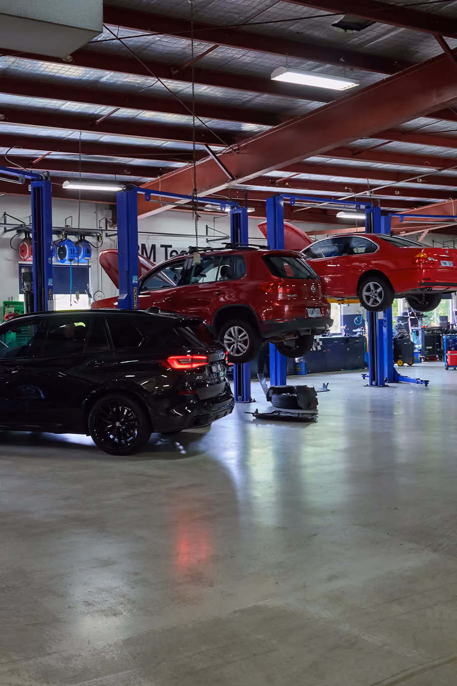 BM Tech servicing centre with a white vehicle getting work done.