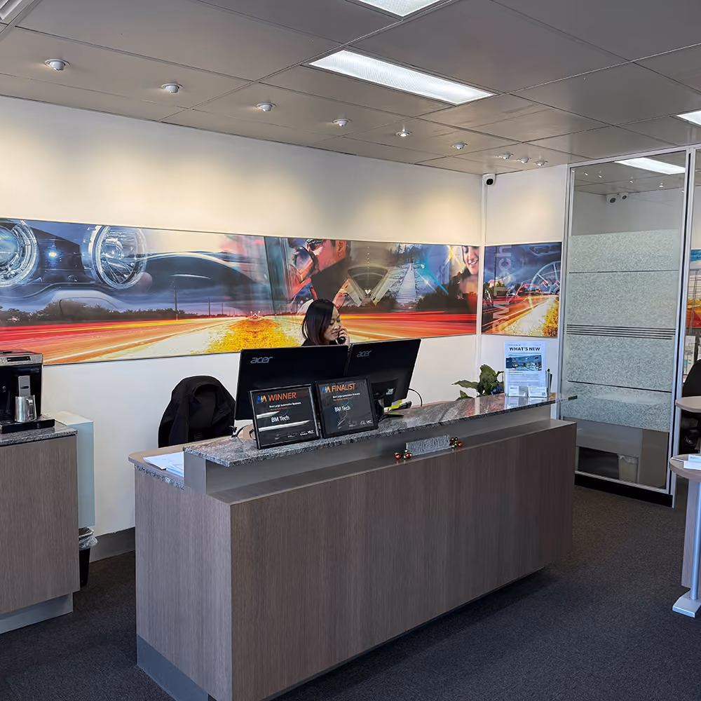 BM Tech receptionist at the front desk with industry awards
