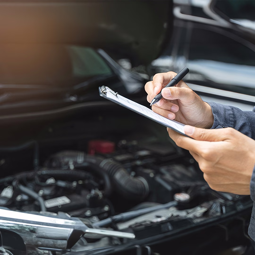 BM Tech technician completing a logbook service on a European vehicle.