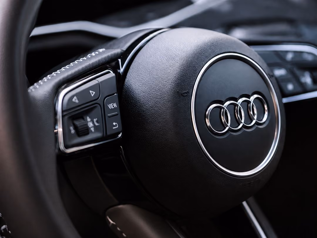 BM Tech technician performing scheduled maintenance on an Audi in Melbourne.
