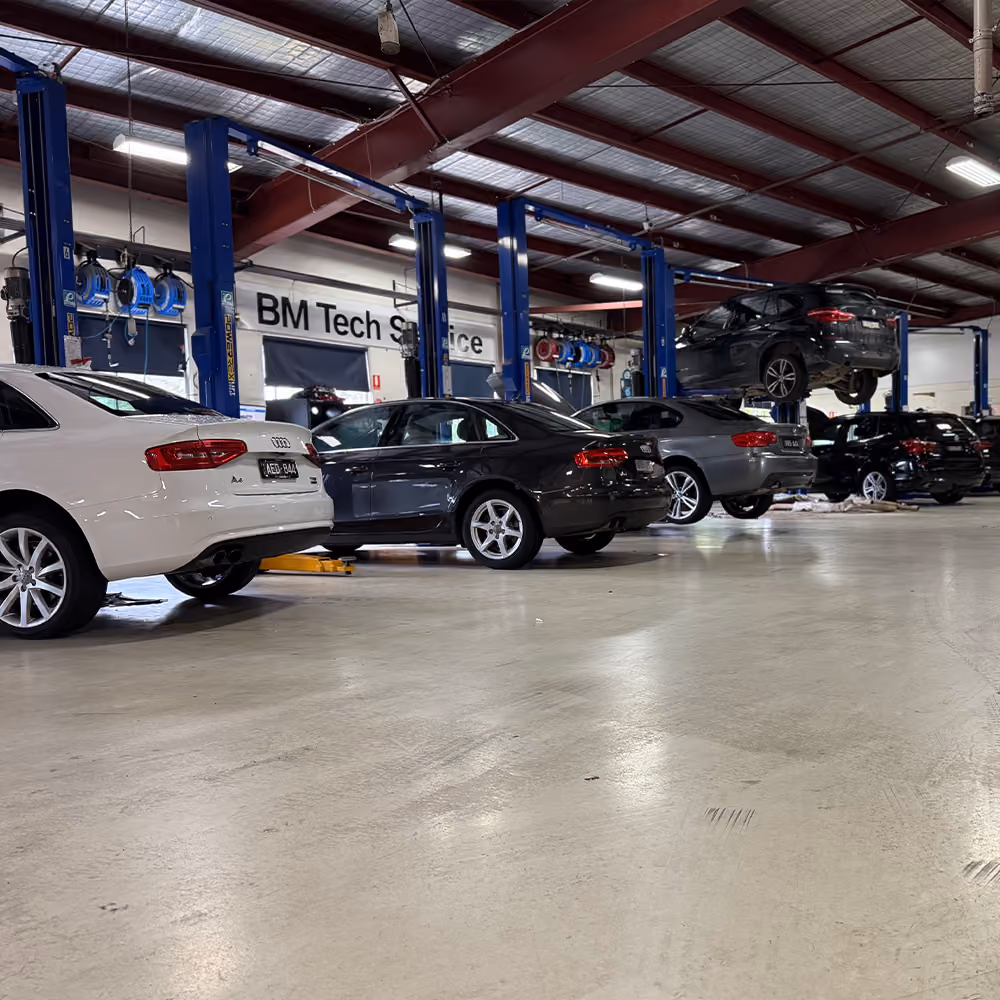 BM Tech technician performing a scheduled Audi service in a Melbourne workshop.