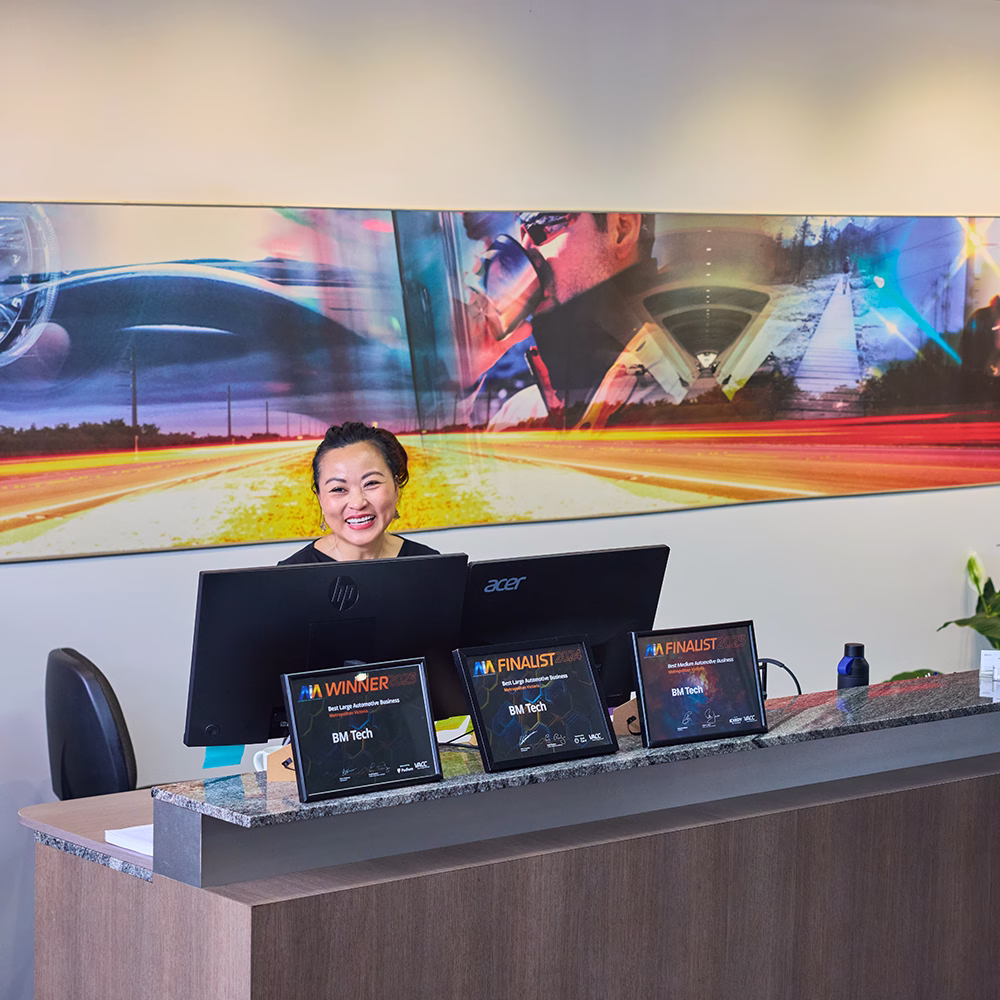 BM Tech receptionist at the front desk with industry awards