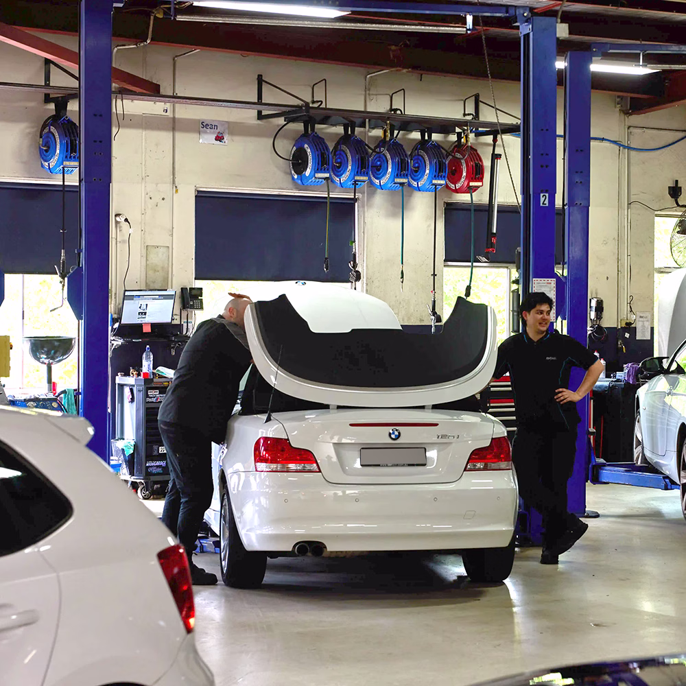 BMT Technicians working on a BMW convertible in the BMT Workshop