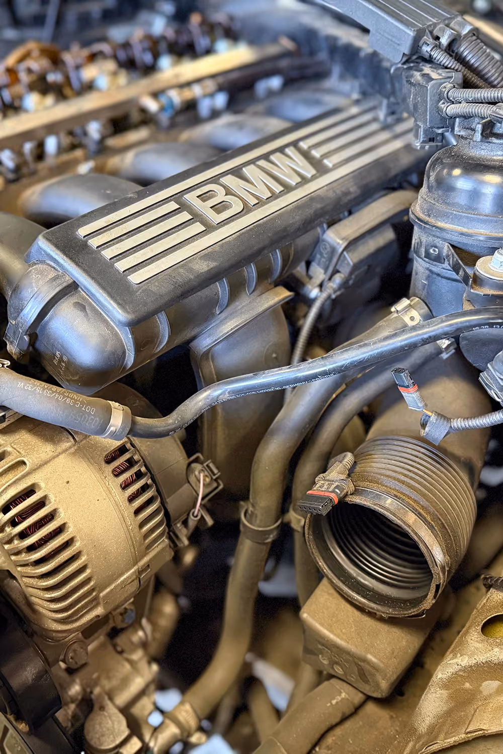 Close-up of a BMW engine being serviced in the BMT Workshop