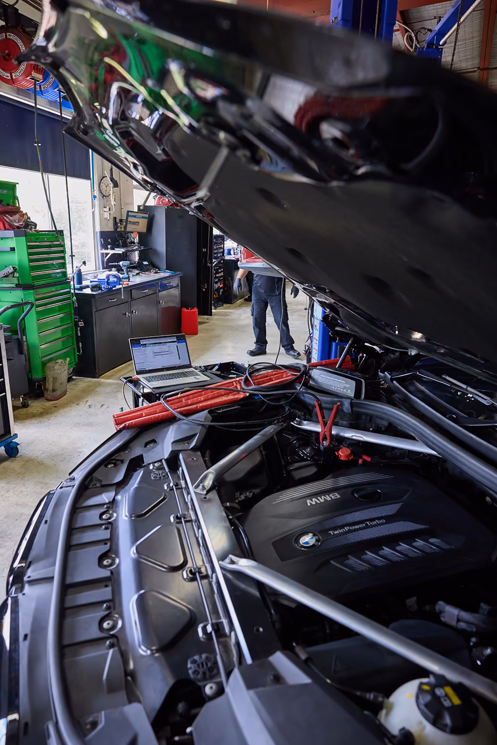 Diagnostic laptop connected to a BMW engine in the BMT Workshop