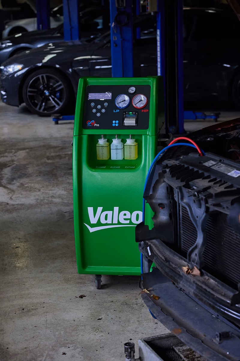 Air conditioning service machine connected to a car in the BMT Workshop