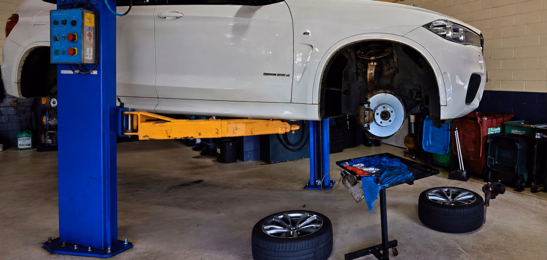 Cars lined up in an Auto Tech Group workshop for tyre service and maintenance in Melbourne.