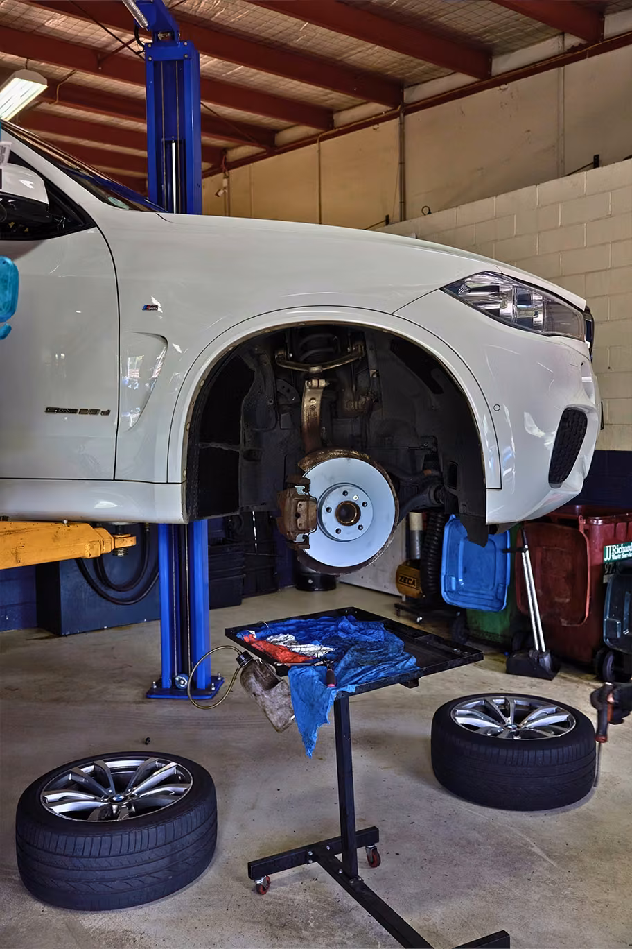 Cars lined up in an Auto Tech Group workshop for tyre service and maintenance in Melbourne.
