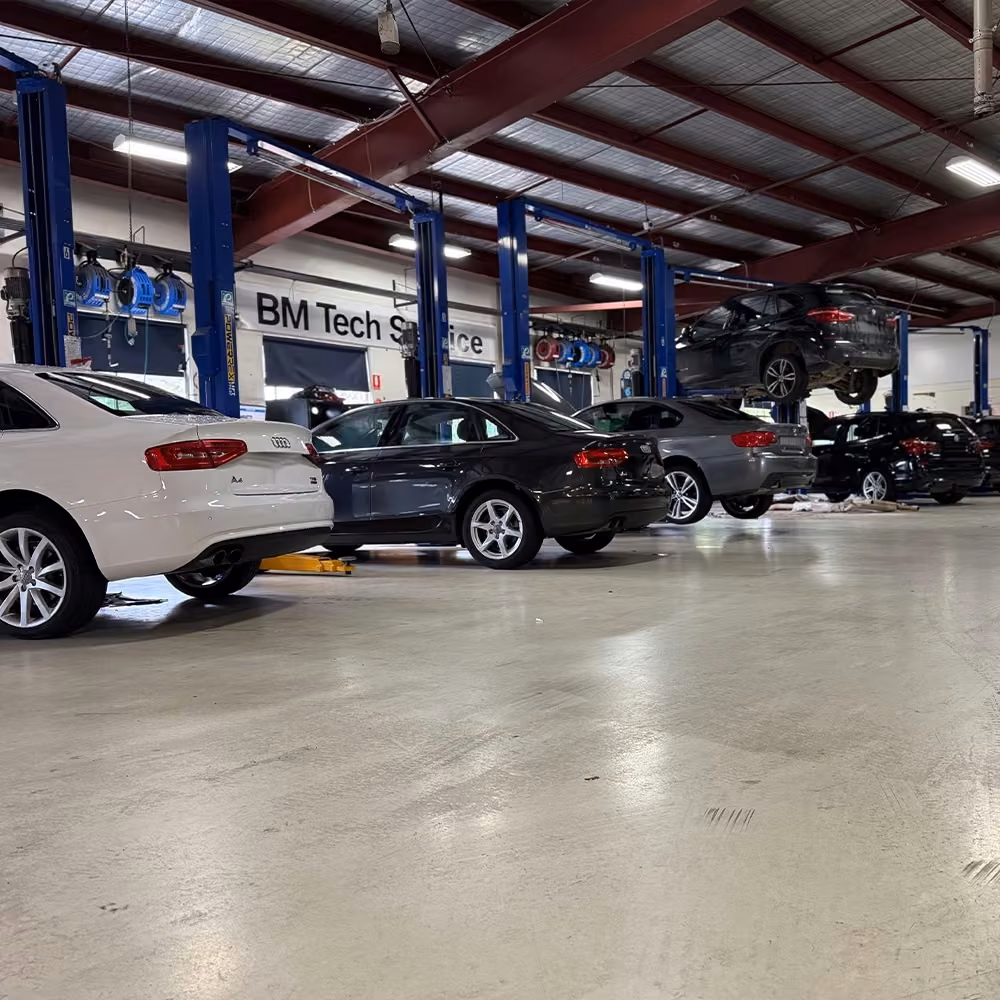 BM Tech technician performing a scheduled Audi service in a Melbourne workshop.
