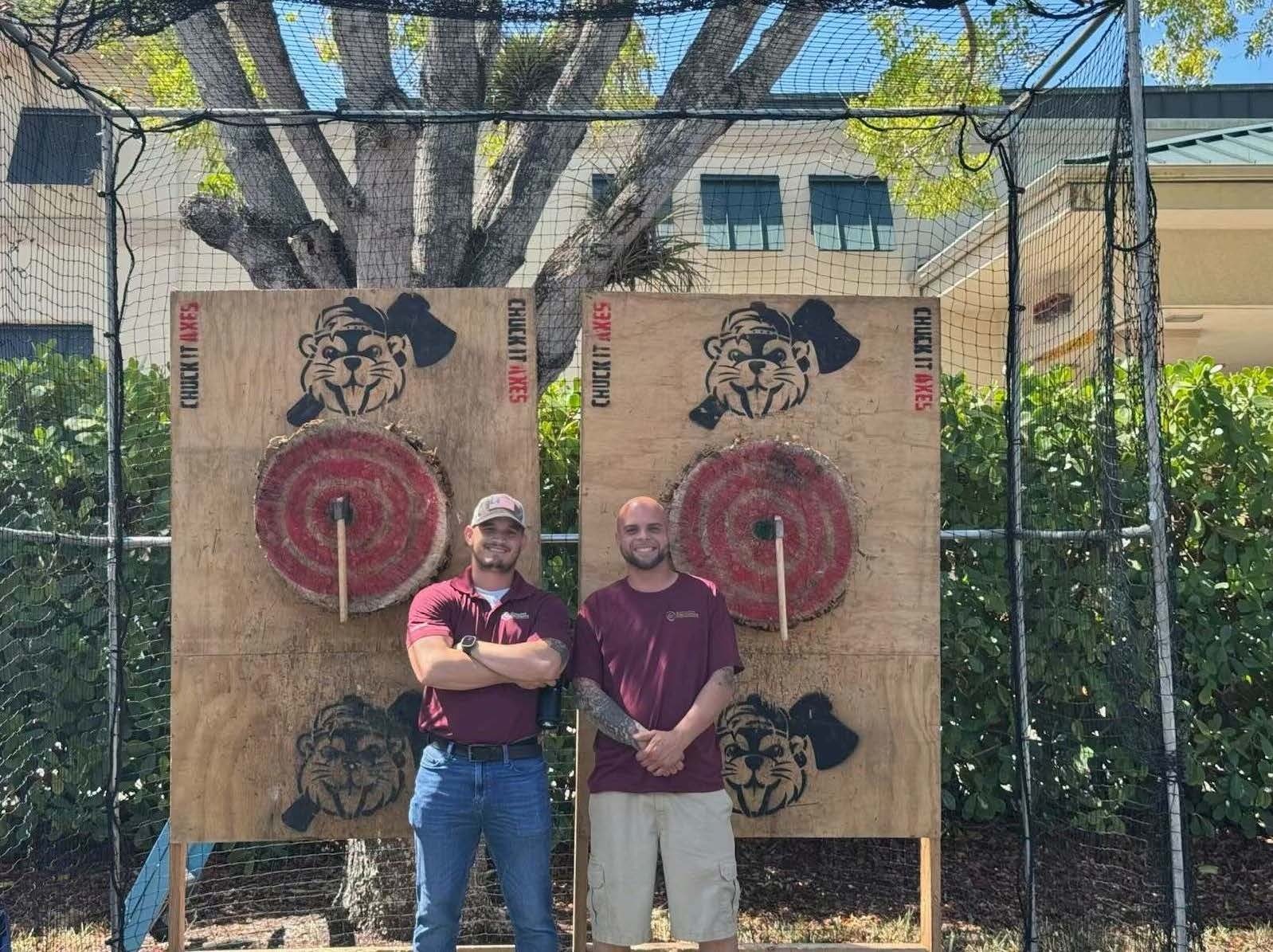 Team members at a company axe-throwing outing