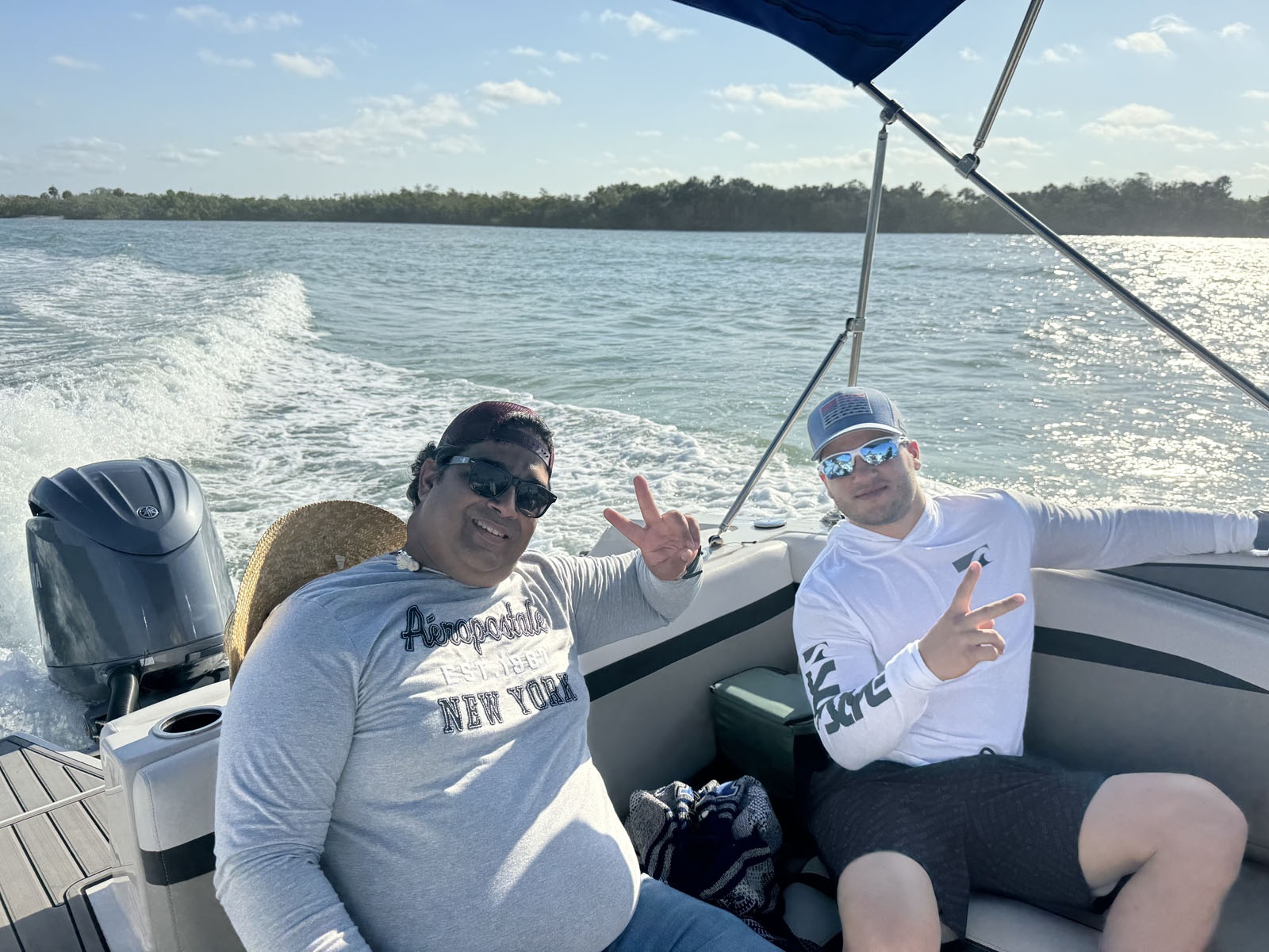 Team members boating on the gulf