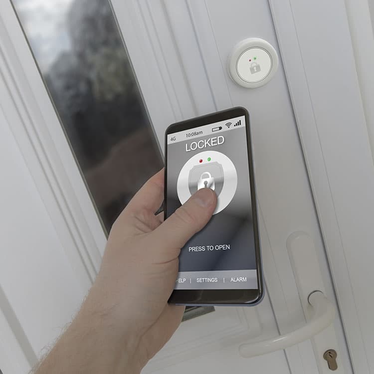 Hand unlocking a front door from a smart phone app